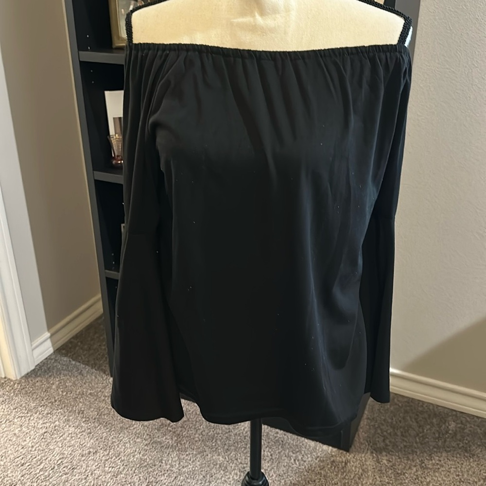 Black, bell sleeve top. Can be worn off the shoulder